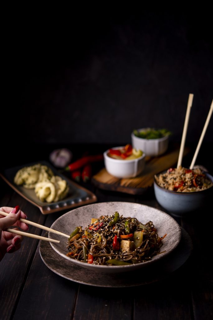 high angle bowl noodles with other asian food (1)